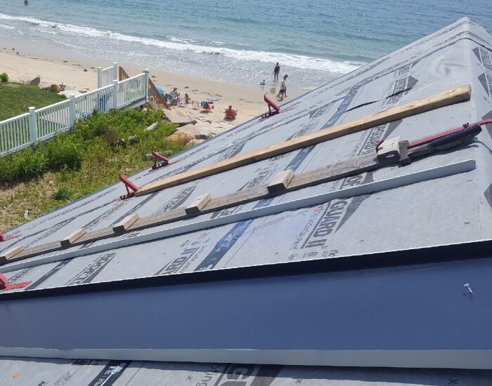 proper installation of a metal roof near a beach