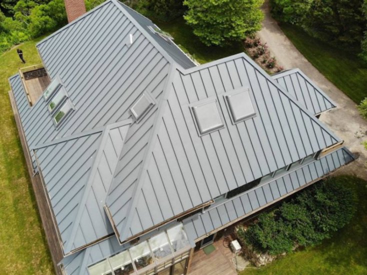 a standing seam metal roof in grey with a view from above