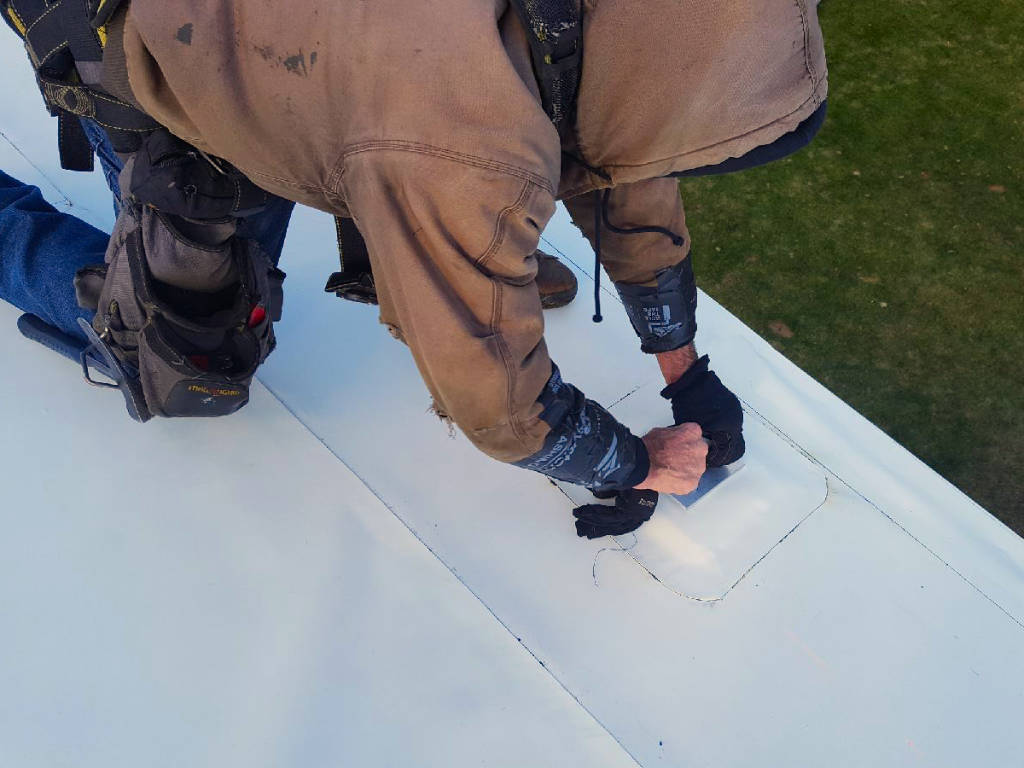 a metal roofing contractor installing durable flat low slop roofing in MA, CT, NH, or RI