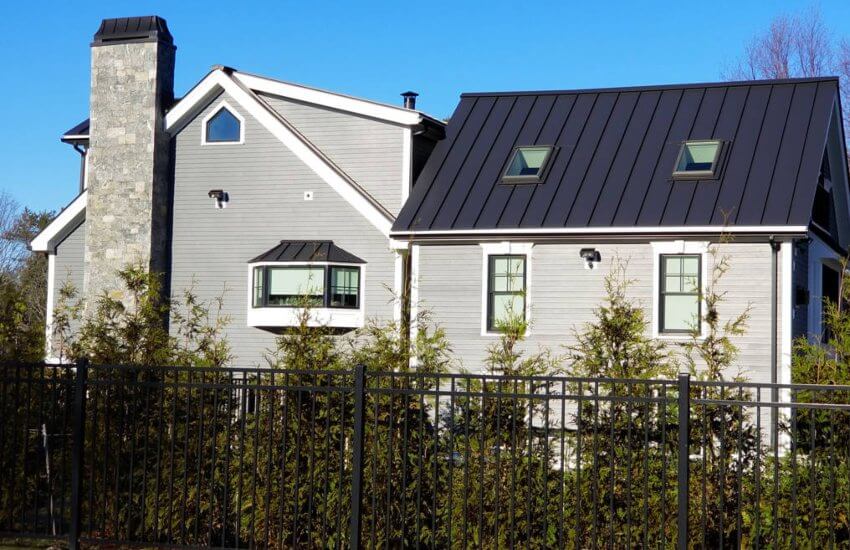 Black metal roofing panels on grey house in RI CT MA NH