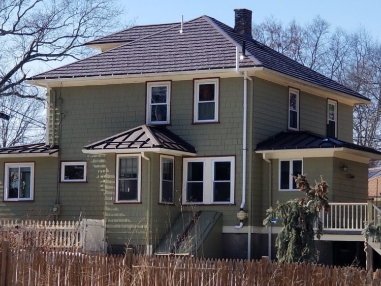 Aluminum shingles like the ones on this roof in Maynard, MA are popular because they are environmentally friendly and durable.