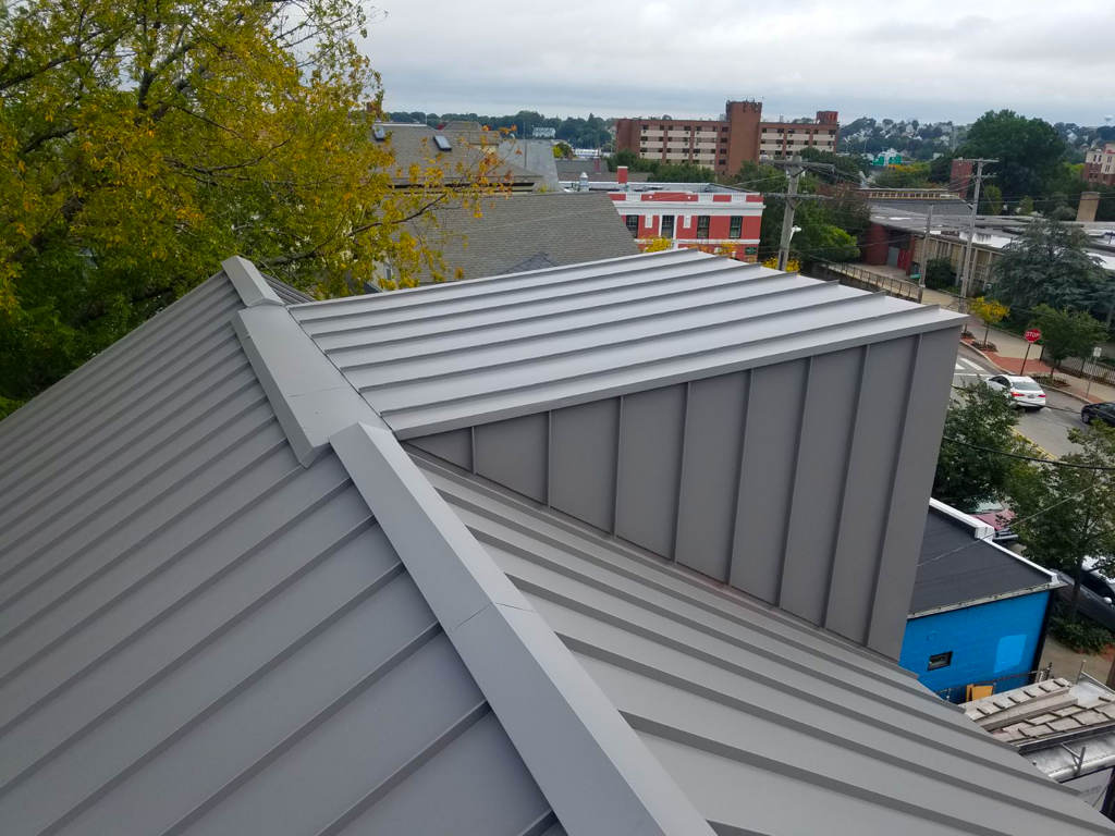 Closeup of a grey standing seam metal roof in New Hampshire.