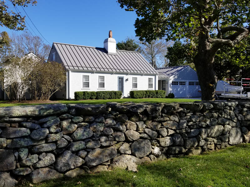 A grey metal standing seam roof on a home in Dartmouth, MA.