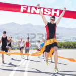 A runner crossing the finish line.