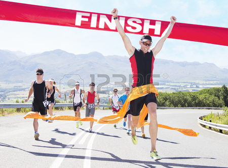 A runner crossing the finish line.