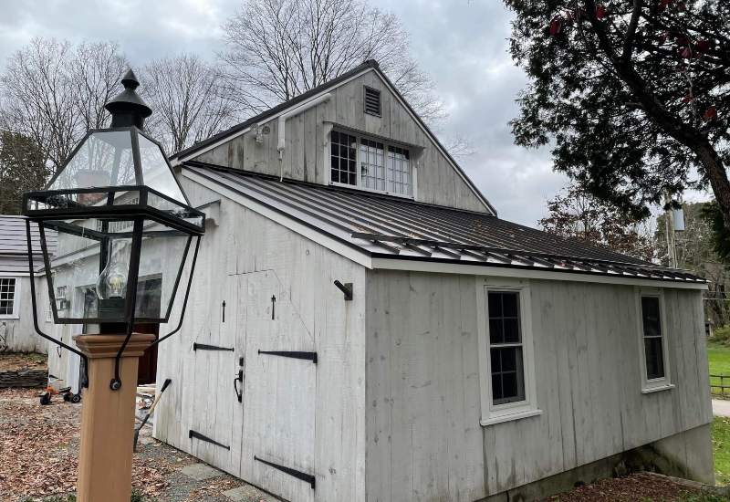 The old house with metal roof and lamp light