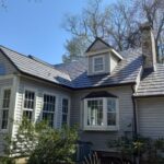 metal roof shingles on a cottage-style home in MA, CT, RI, or NH
