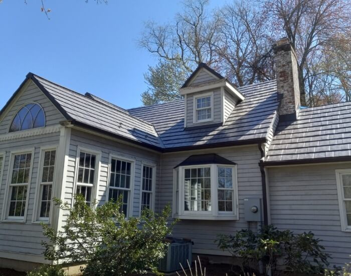 metal roof shingles on a cottage-style home in MA, CT, RI, or NH