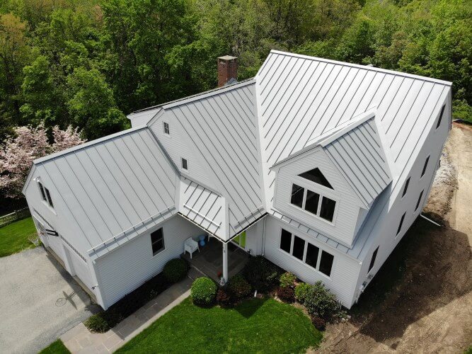Alumimnum standing seam metal roof home in New Hampshire