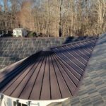 Metal panel system roof with concealed fasteners
