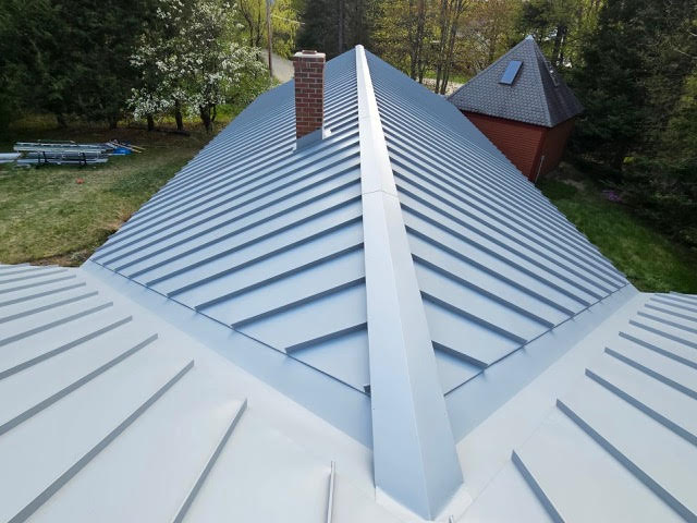 standing seam metal roof in dove gray on a house in MA, CT, NH or RI