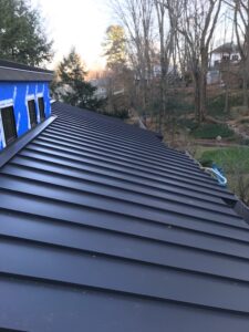 A closeup of a black metal standing seam roof in Bedford, NH.