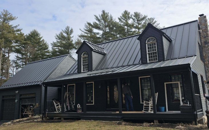 A home with a blue standing seam metal roof in North Reading, MA.