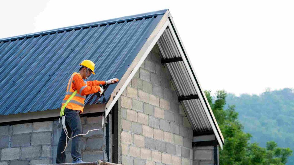 A man is diligently working on the roof of a house, ensuring its maintenance and safety.