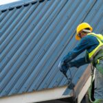 Construction worker wearing safety harness belt during working o